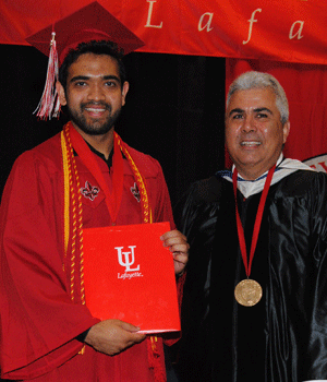 Zadid Haq receiving the Spring 2015 Ray P. Authement College of Sciences Outstanding Graduate Award from Dean Ackleh