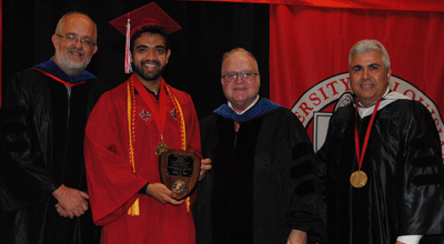 Zadid Haq receiving the Bradd Clark Excellence in Undergraduate Research Award from Dr. Paul Leberg, Dean Emeritus Bradd Clark, and Dean Azmy Ackleh