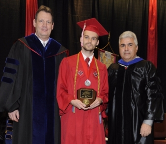 Jade Bujard receiving the Fall 2014 David R. Andrew Scholar Award from Dr. Carl Richter and Dean Ackleh